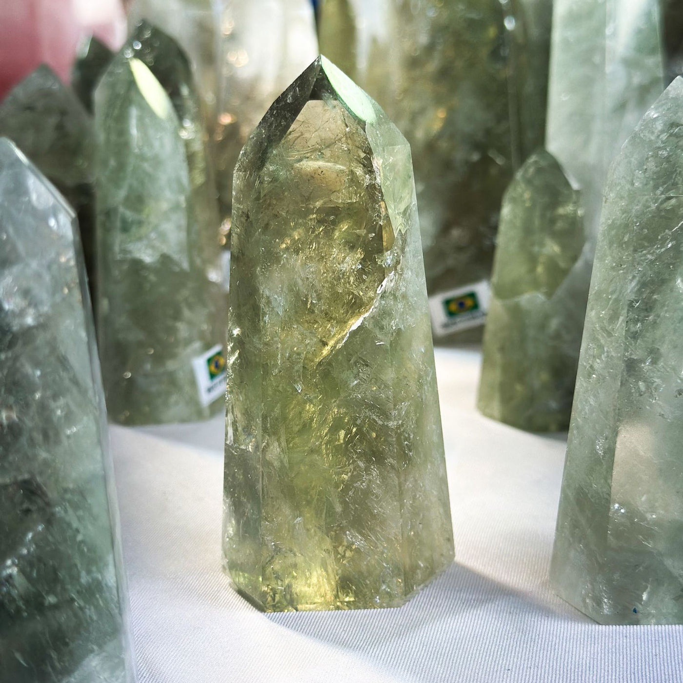 close up view of one Prasiolite crystal Point at the 2024 Tucson Gem Show by Energy Muse