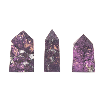 three different Purpurite crystal points illustrating variations in size, pattern and color by Energy Muse
