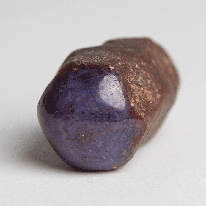 gif of raw UV-reactive star ruby corundrum stick by Energy Muse