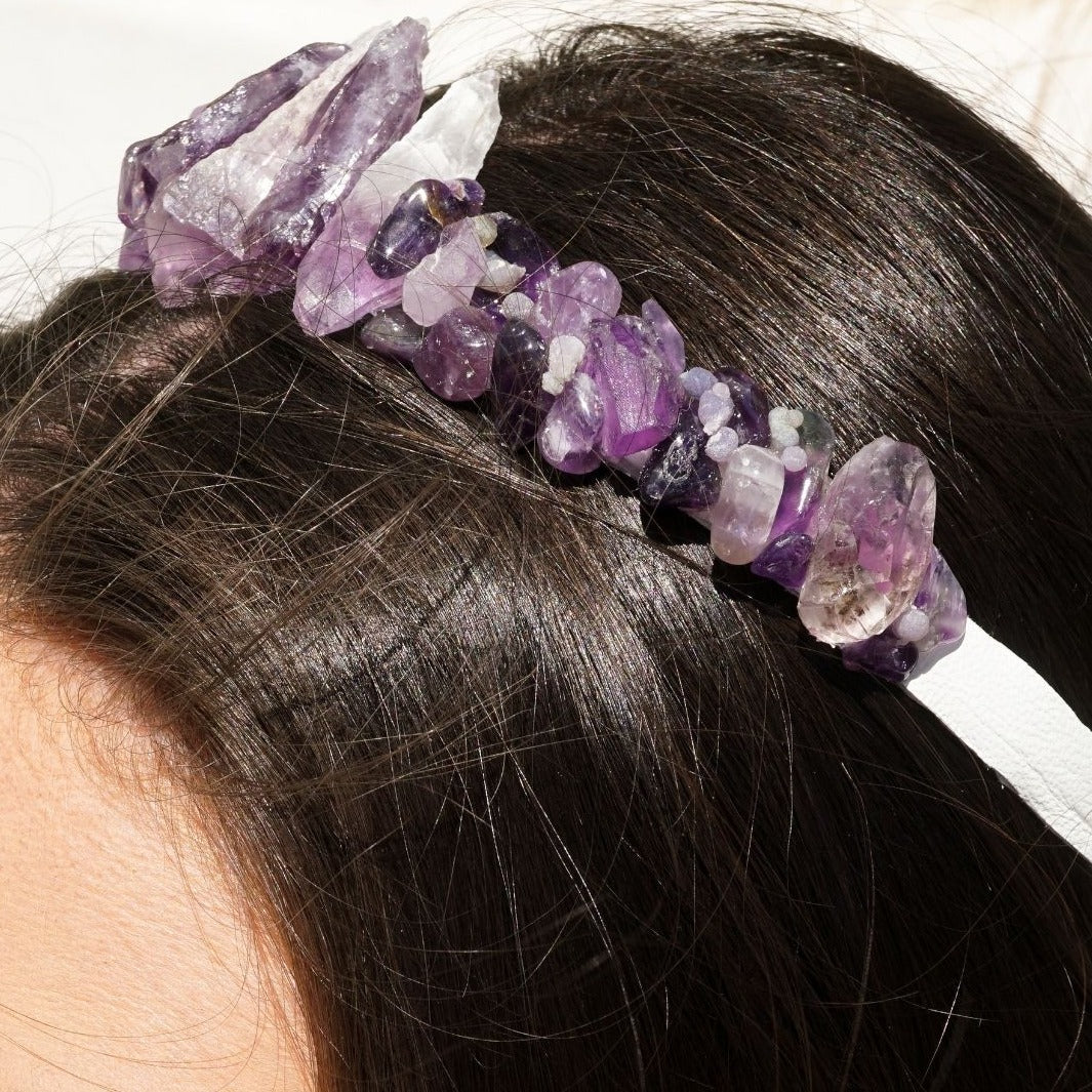 Side view closeup of a brunette woman wearing a crown tiara headband with genuine raw Amethyst crystals by Energy Muse