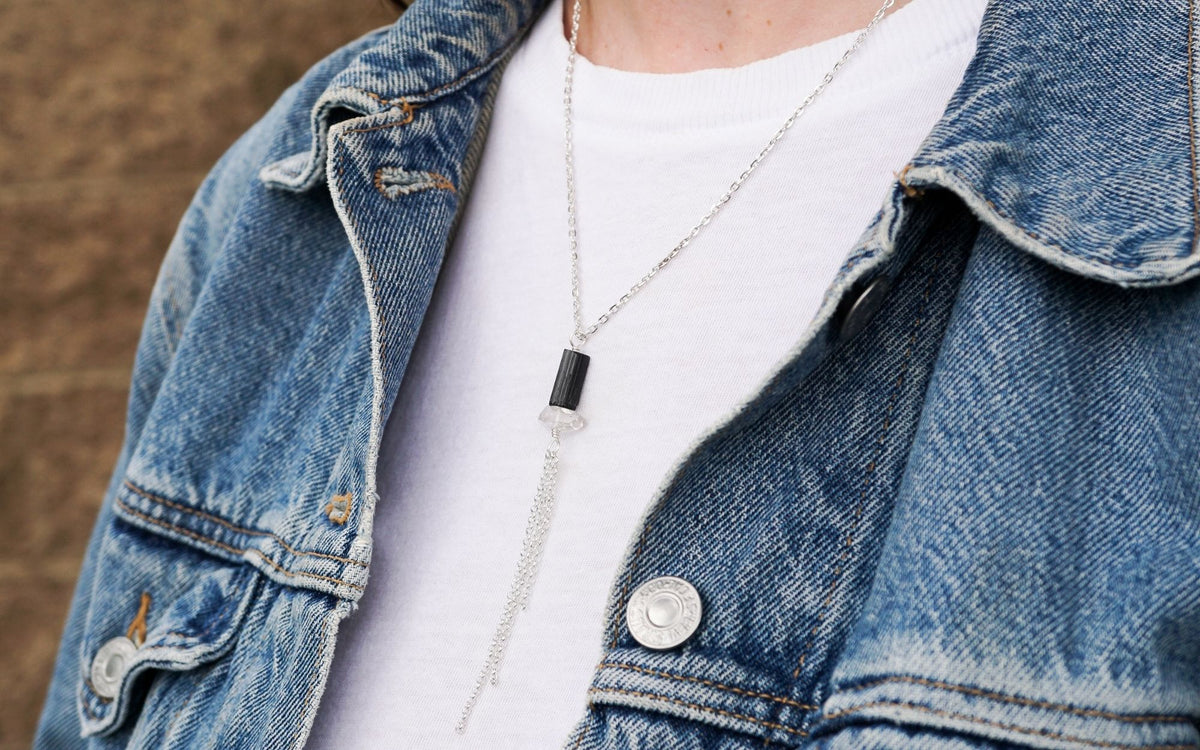 silver tassel necklace with genuine Black Tourmaline and Herkimer Diamond crystals stylized against white t shirt by Energy Muse