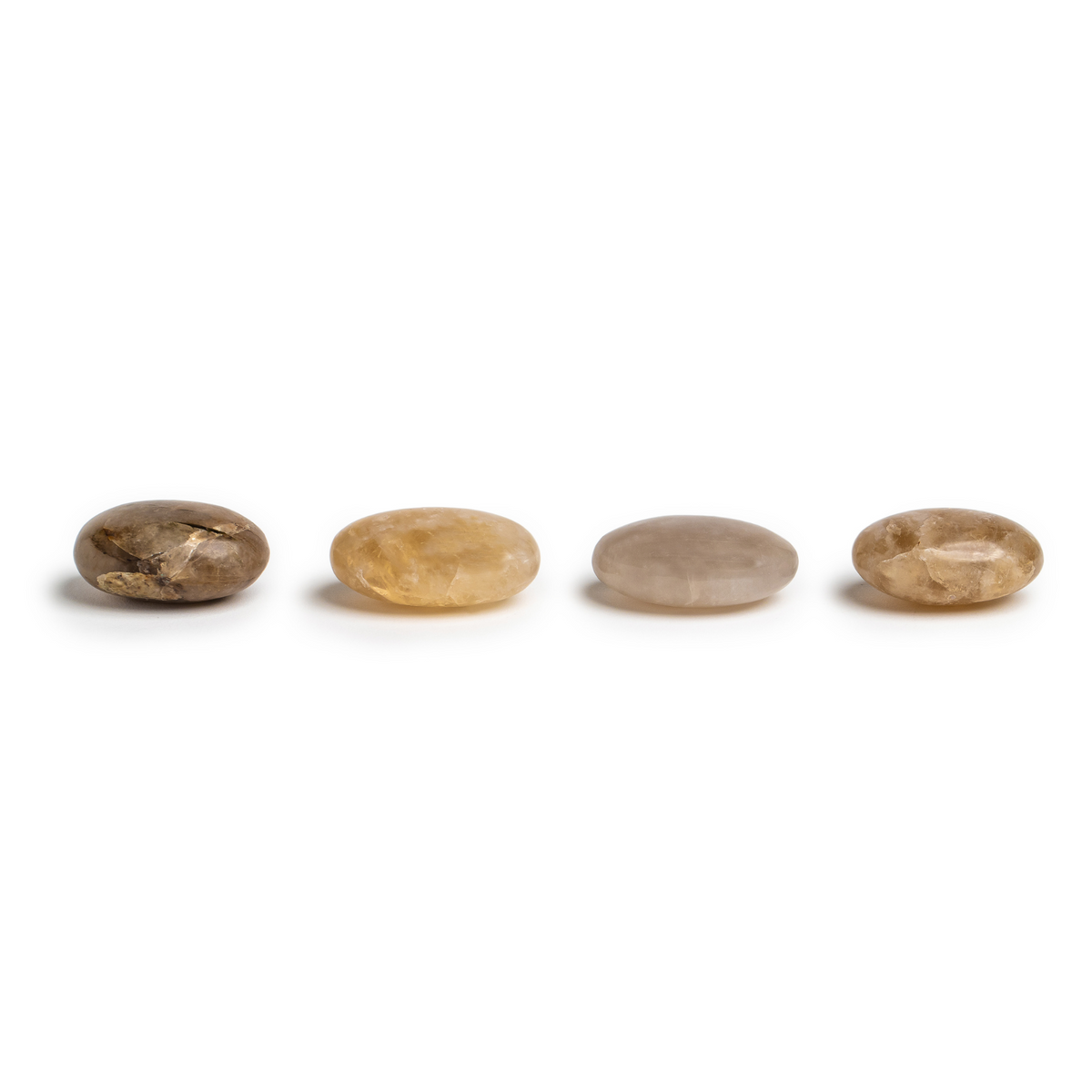 a lineup of 4 distinct smoky quartz touchstone crystals showing variety in coloration, patterns and size by Energy Muse