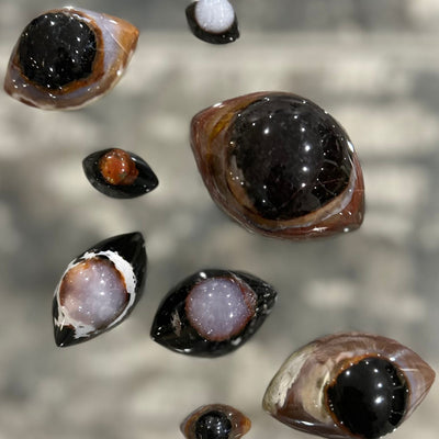 Collection of several Shiva Eye Agate crystals by Energy Muse to show the variety of colors, patterns, sizes and shapes by Energy Muse