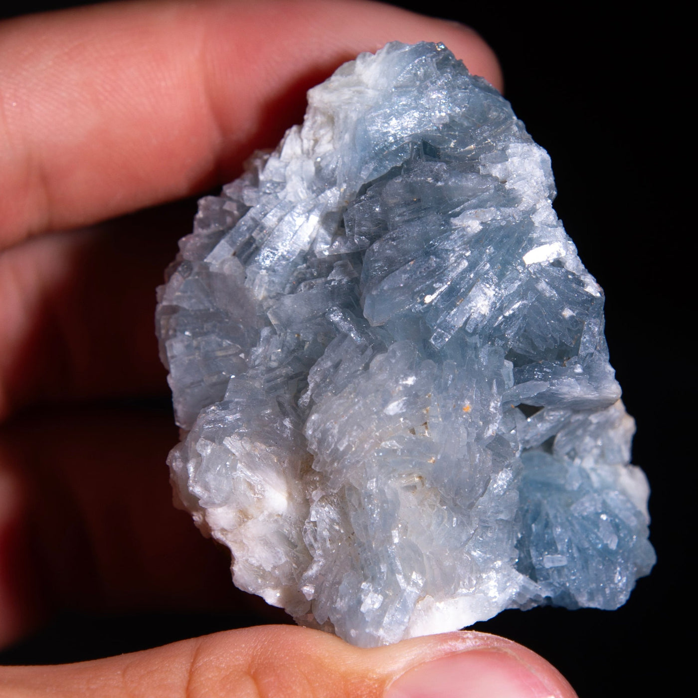 genuine Blue Barite Crystal in hand by Energy Muse