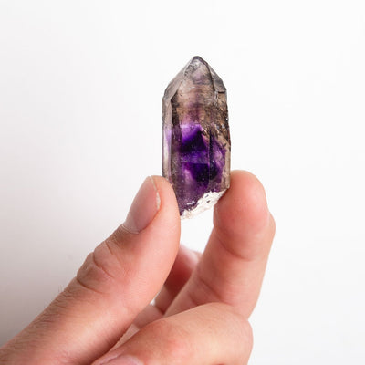 Man holding genuine Brandberg Amethyst crystal to show its size by Energy Muse