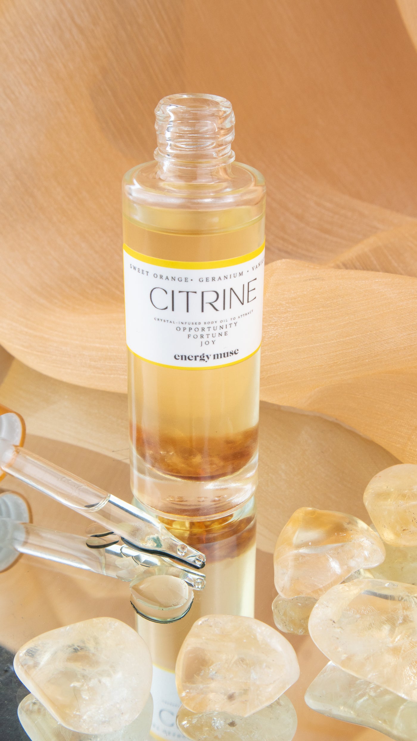 citrine body oil by Energy Muse with citrine stones 
