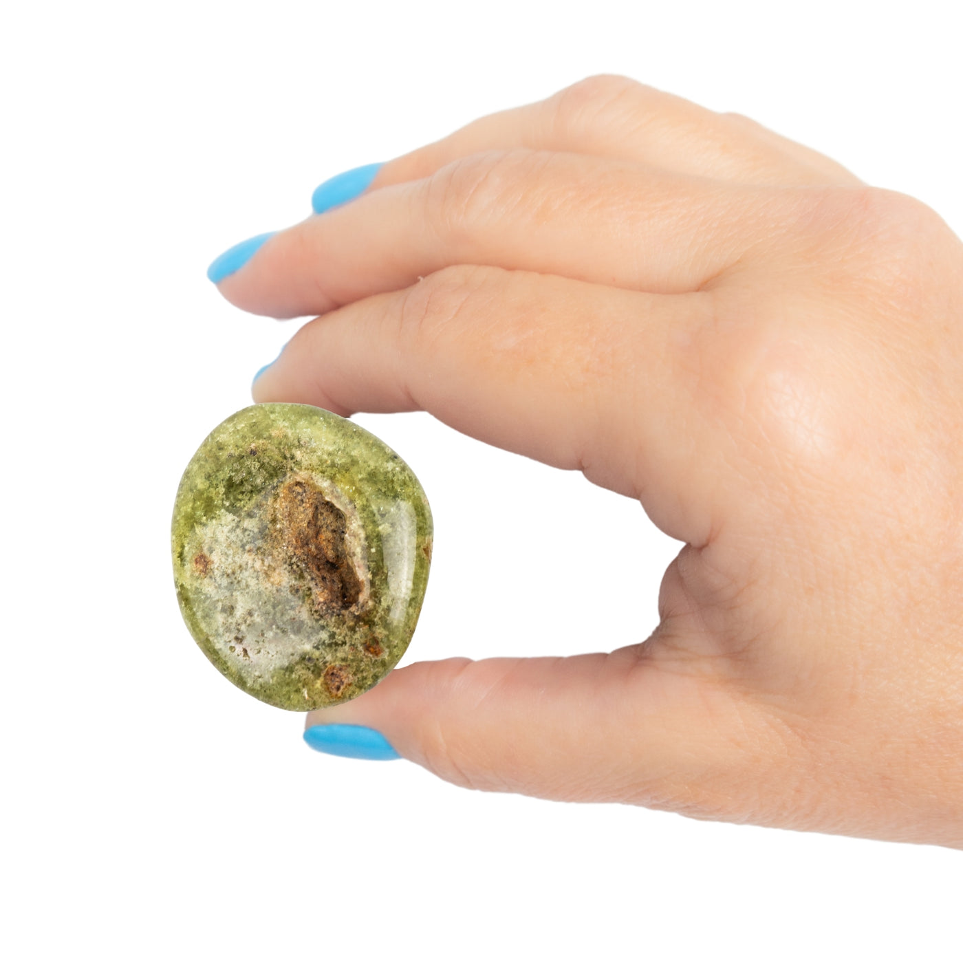 Person holding genuine Green Garnet pocket stone by Energy Muse to show its size.