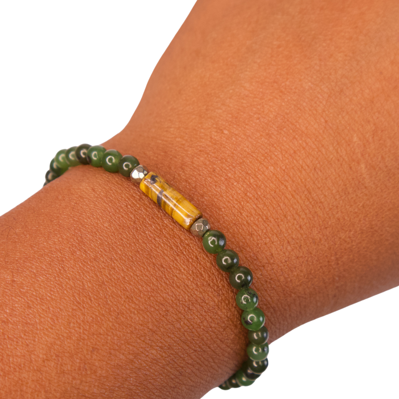 Close up view of Black woman's wrist wearing a Jade, Tiger's Eye and Pyrite Financial Advisor Bracelet by Energy Muse