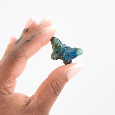 Woman holding Labradorite crystal Butterfly to demonstrate size by Energy Muse 