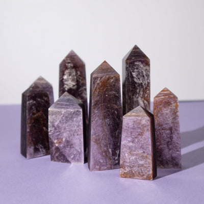 Group of genuine Lepidolite obelisk points showing variety of colorations, patterns, thicknesses and shimmer by Energy Muse