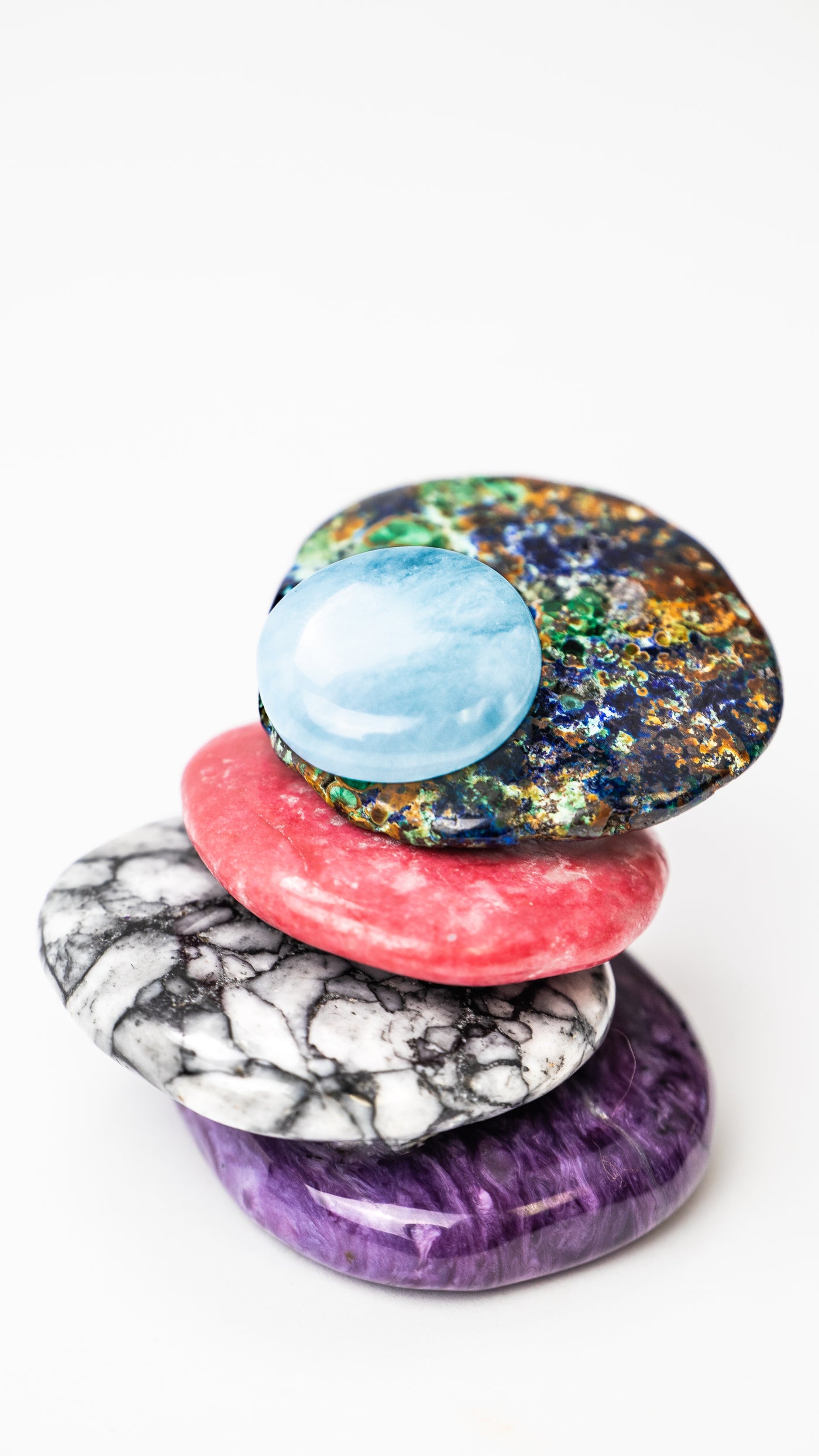 stack of new pocket stones: Azurite, THulite, Pinolith and Charoite by Energy Muse