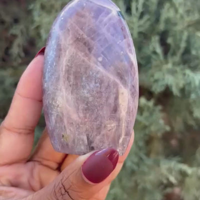 video showing shimmer of a Purple Anhydrite Freeform crystal from Tucson Gem Show - Energy Muse