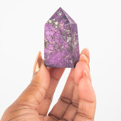 Woman holding genuine Purpurite crystal at Energy Muse