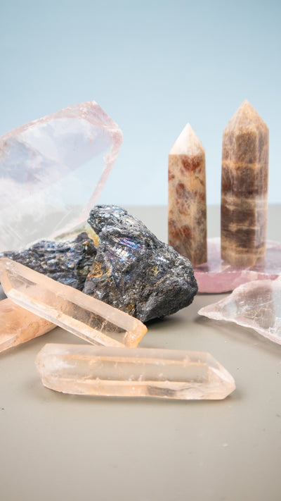 group of rare crystals: Pink Lemurian Seed Crystal, Selenite Lithium Slabs, Stibnite Crystals and Moonstone with Sunstone Points by Energy Muse