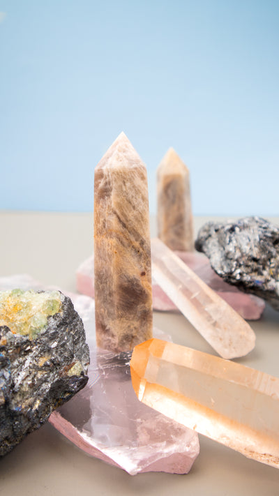 Rare crystals from Tucson Gem Show: Moonstone with Sunstone Point, Stibnite Crystal, Pink Lemurian Seed and Selenite Lithium Slab by Energy Muse