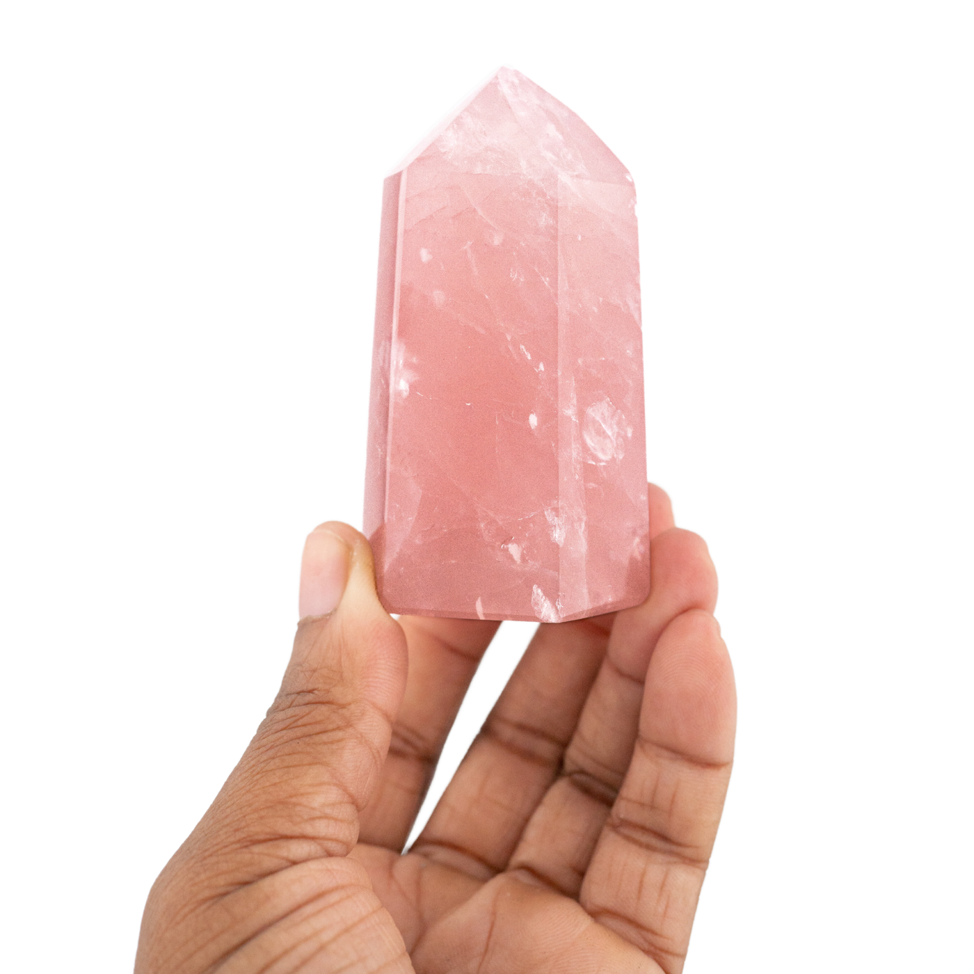 Woman holding up Rose Quartz pillar by Energy Muse