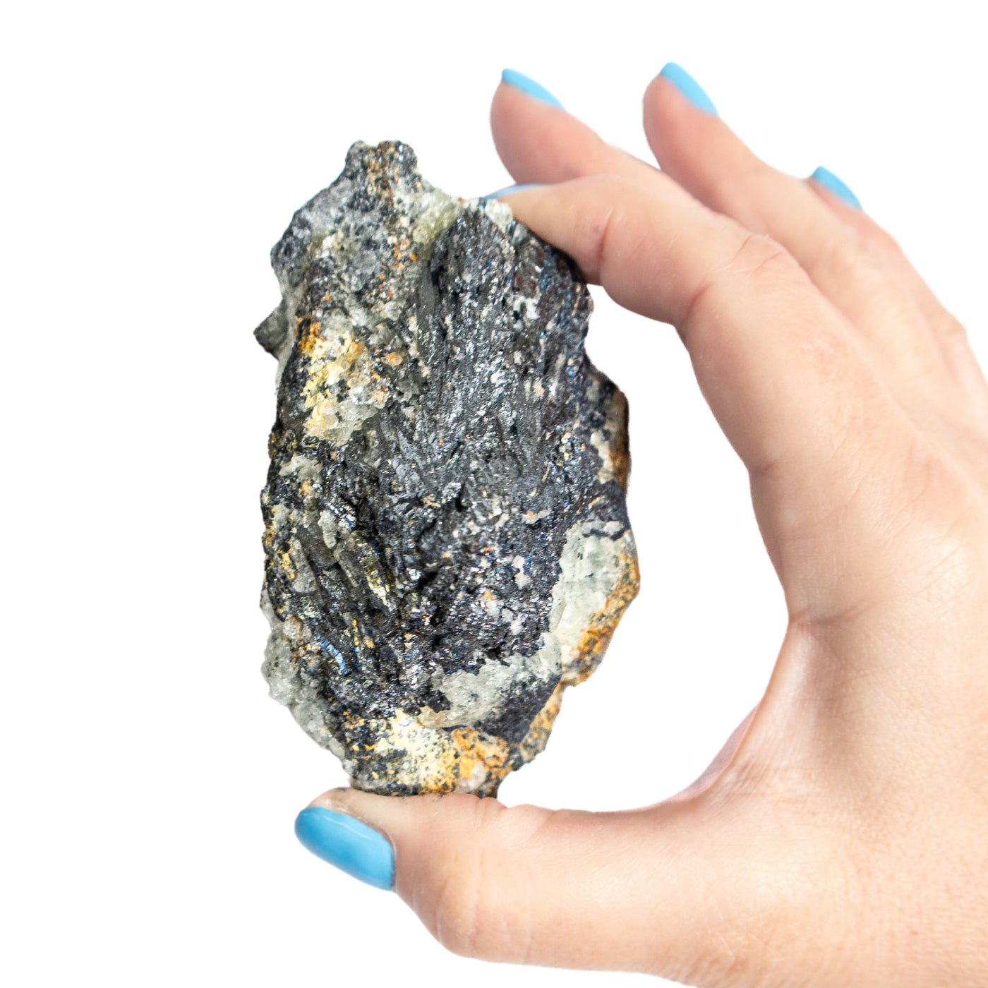 woman holding up Stibnite crystal by Energy Muse