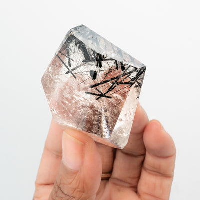 woman holding genuine tourmalinated quartz freeform crystal by Energy Muse
