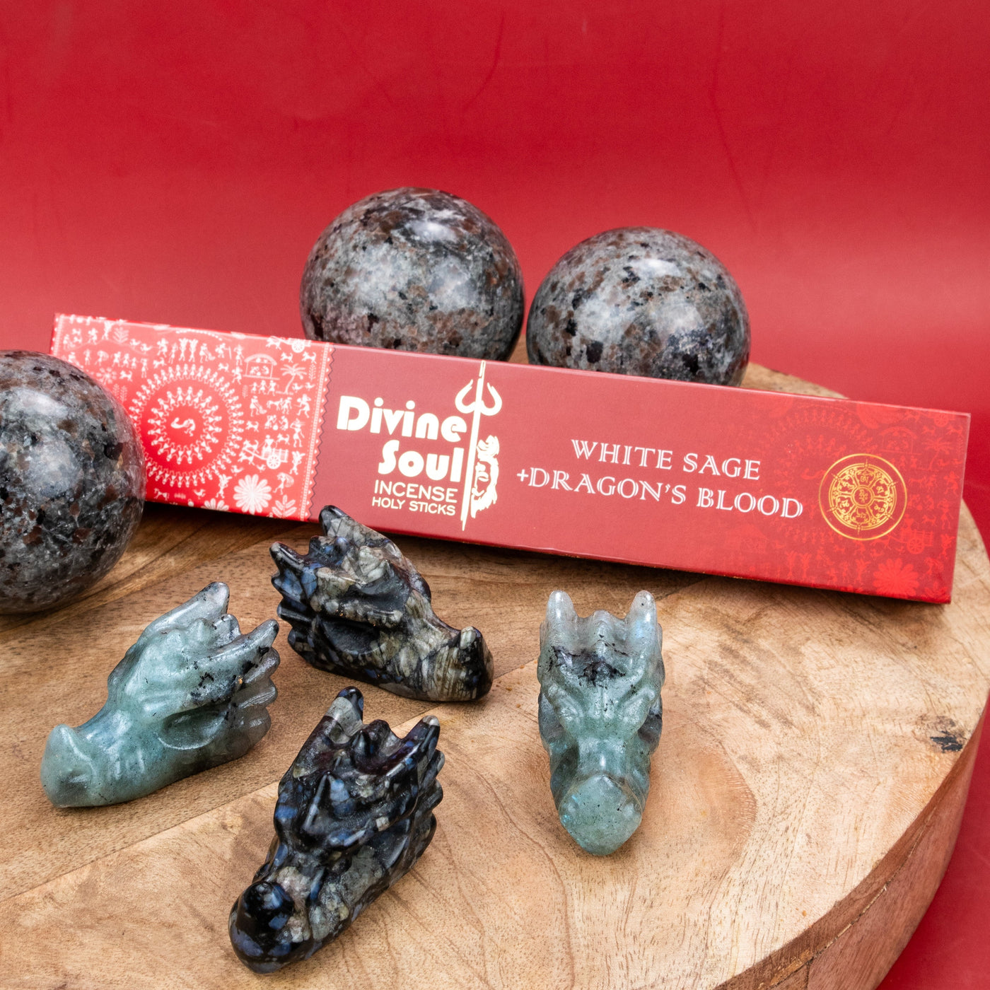 Stylized collection of Que Sera Dragon carving crystal, Labradorite Dragon carving crystal, UV Yooperlite Sphere and dragon's blood incense for the Year of the Wood Dragon by Energy Muse