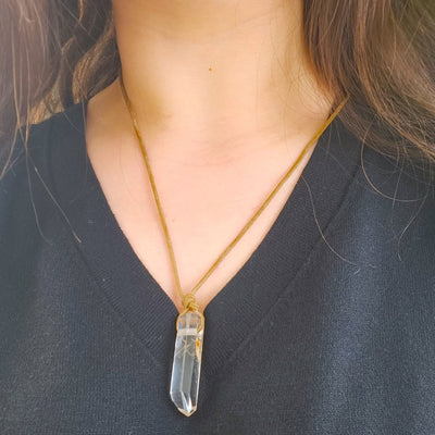 woman wearing clear quartz pendant adjustable necklace by energy muse 