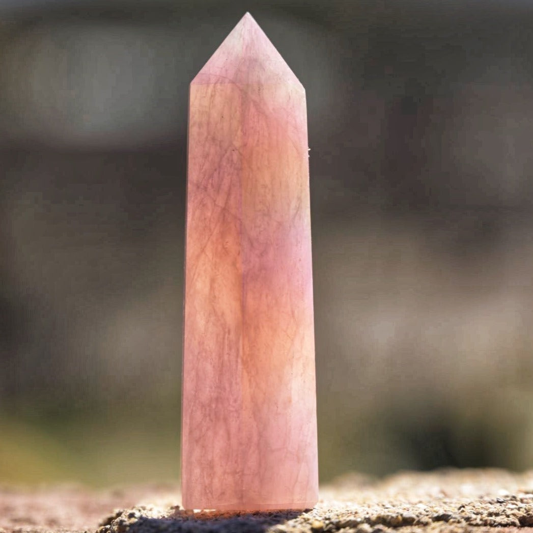 outdoor view of angel aura rose quartz tower point crystal - Energy Muse