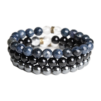 product view of Mercury Retrograde bracelet trio by Energy Muse featuring a faceted Sodalite elastic bracelet, a smooth bead Black Tourmaline stretch bracelet and smooth Hematite bead stretch bracelet. 