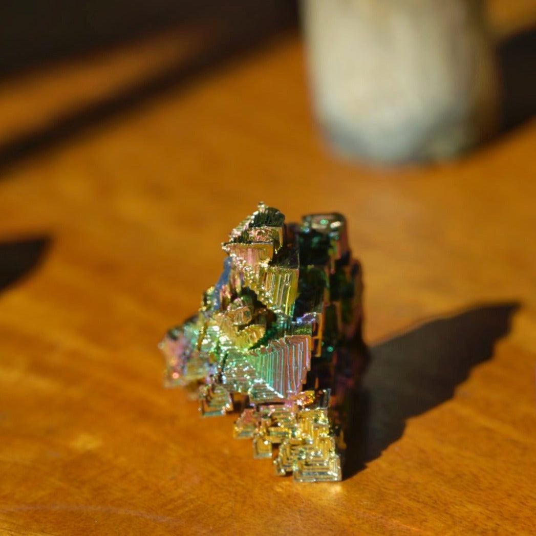 side view of Rainbow Bismuth Crystal in home by Energy Muse