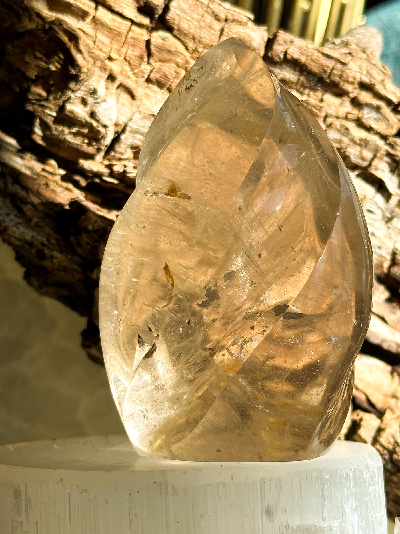 Smoky Quartz Flame carved crystal pictured outside by Energy Muse