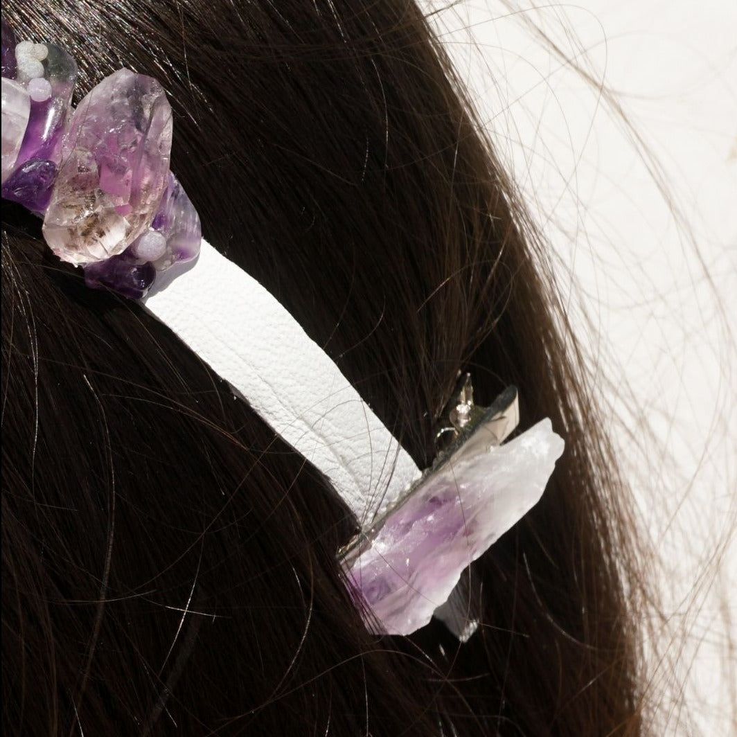 Side closeup view of a brunette woman wearing frontal view of genuine Amethyst raw point hair clips by Energy Muse