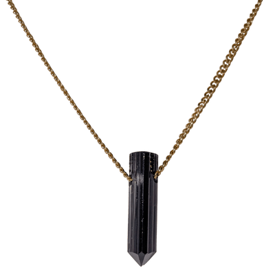 Close up of carved natural Black Tourmaline crystal pendant necklace with brass chain by Energy Muse
