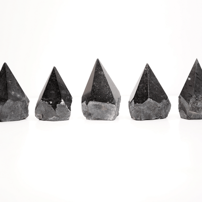 Assortment of 5 half polished Black Tourmaline points by Energy Muse showing the unique variety of shapes, heights, colors, patterns and sizes. 