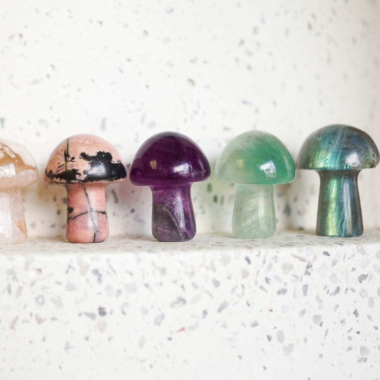 7 mushroom shaped figurines created from natural crystal by Energy Muse