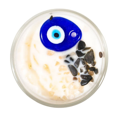 top view of Evil Eye candle with Black Obsidian, Clear Quartz and painted glass evil eye pendant by Energy Muse