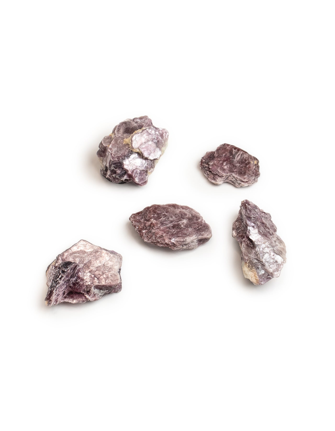 5 different pieces of genuine Lepidolite crystal showing the difference in size, shape and patterns by Energy Muse