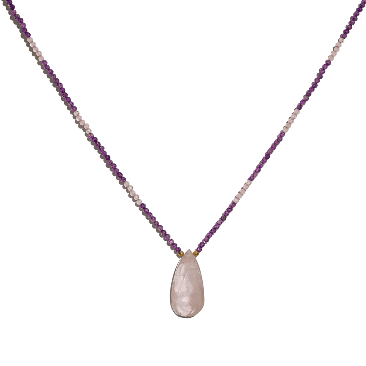 closeup of natural gemstone necklace with rose quart pendant and amethyst and rose quartz seed beads by energy muse