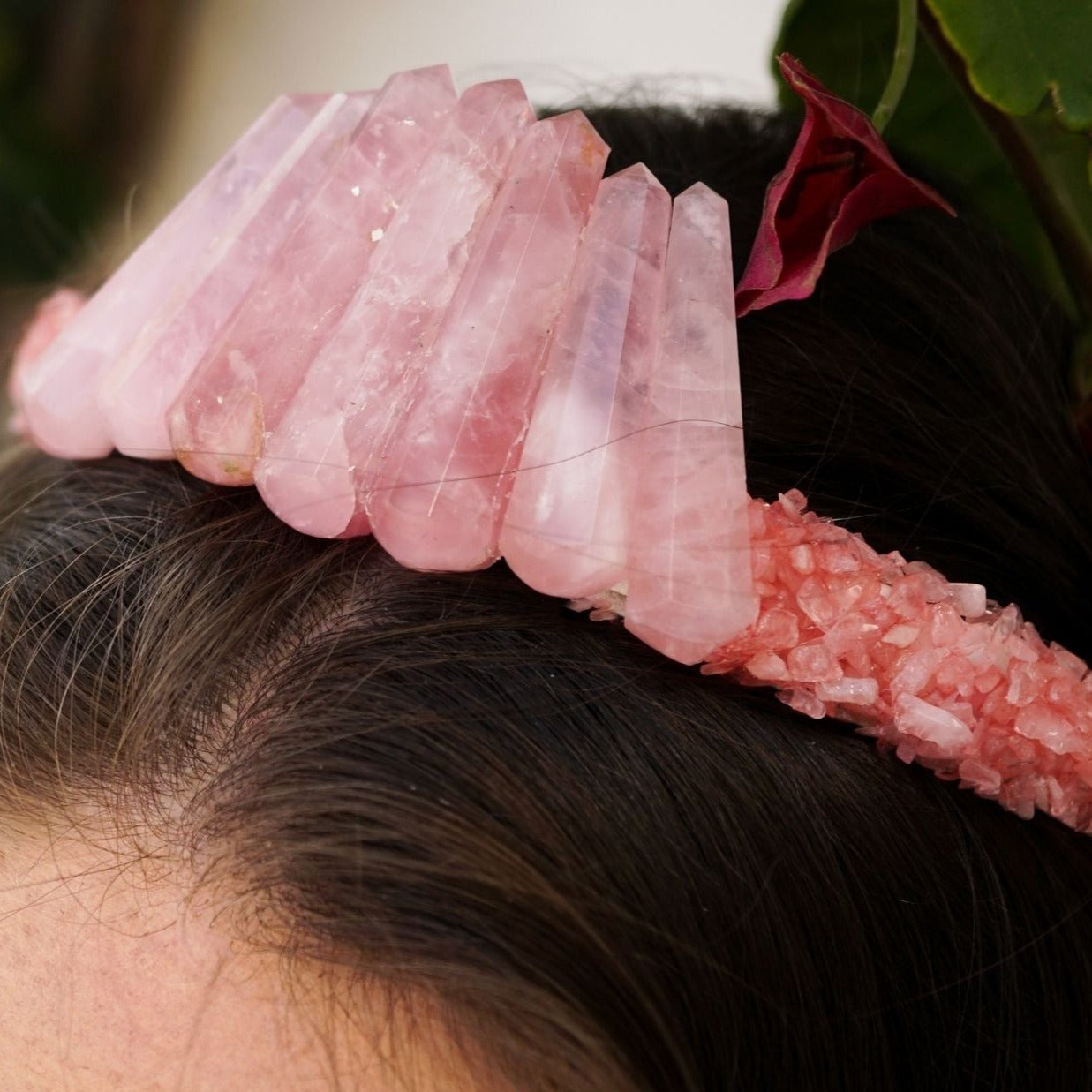 woman wearing handmade leather crown headband covered in genuine rose quartz point crystals by Energy Muse