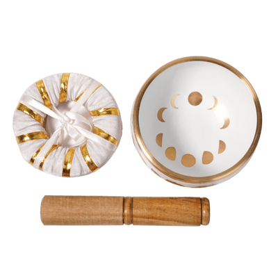 Top view of Hand painted White and gold foil Moon Phase Singing Bowl, pillow and wood stick by Energy Muse